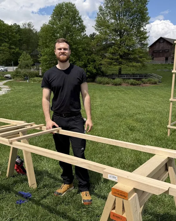 Cade Grubbs building a custom garden trellis